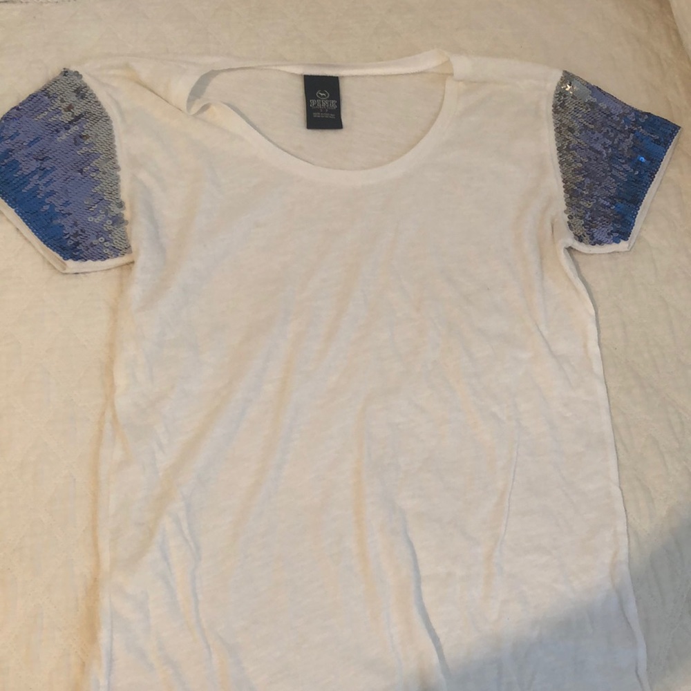 white shirt with blue sequined sleeves